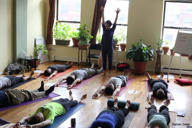 200 hr Yoga Teacher Training group practicing yoga in the Krishnamacharya tradition